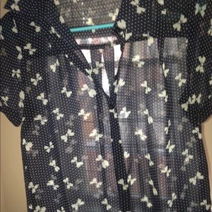 Blue sheer, short-sleeved blouse. Bows/polka dots.